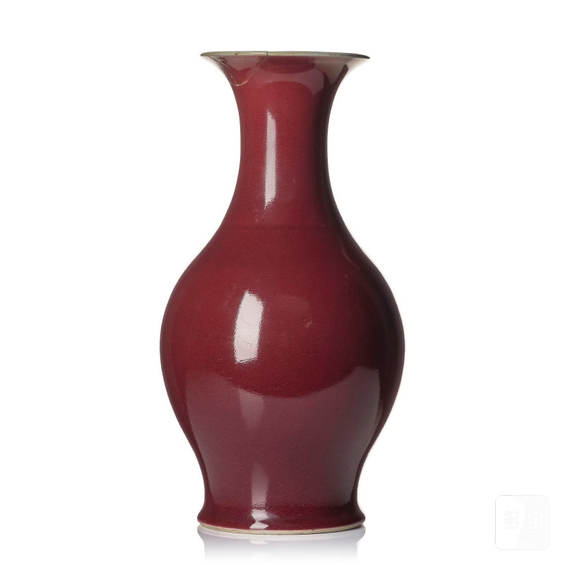 A red glazed vase,